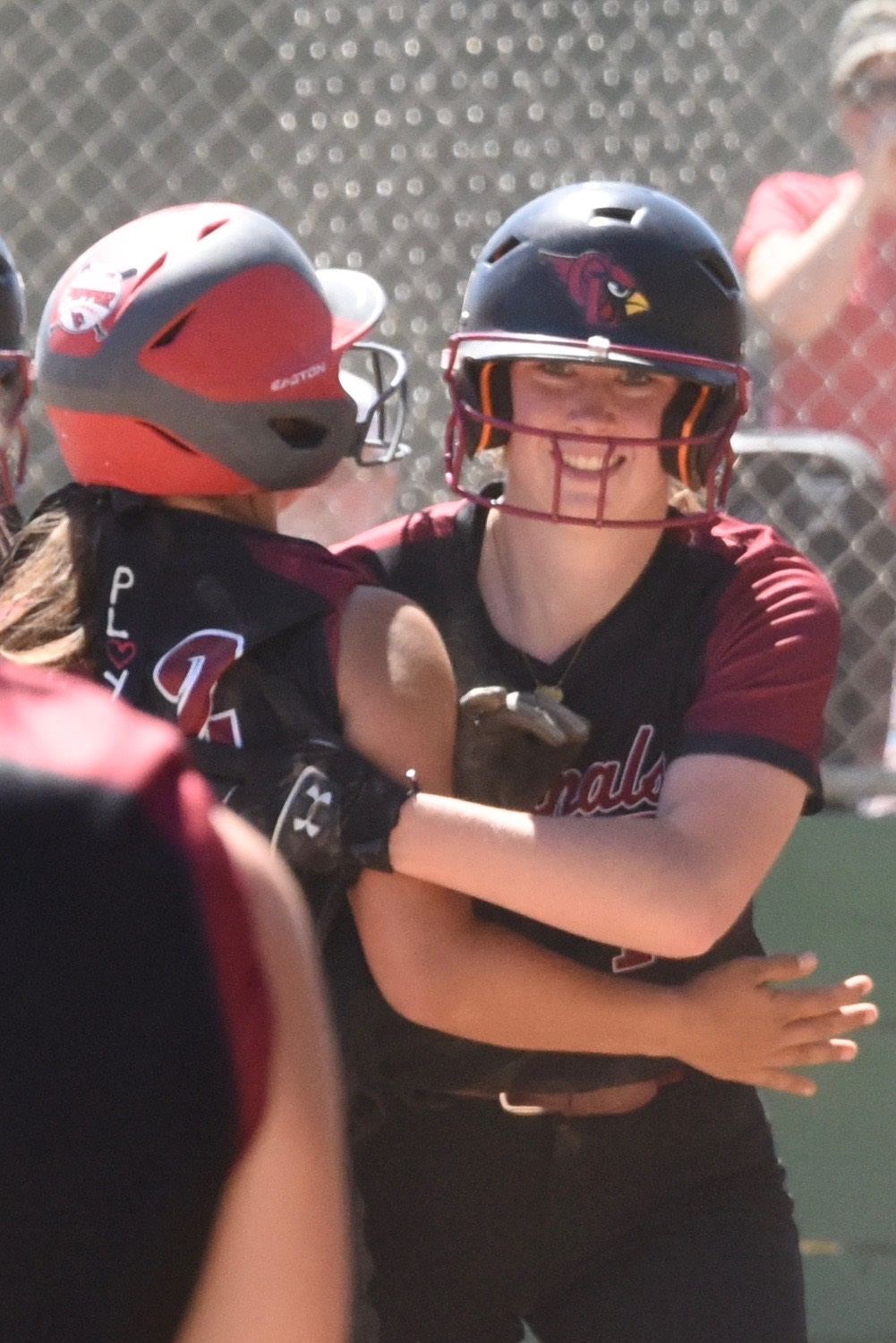 Stella Hill is congratulated after scoring the winning run in the bottom of the eighth inning, breaking a 5-5 tie against Berean Christian in the quarterfinal round of the Division 5 playoffs. Hill also homered during the Cardinals' 6-5 victory. (Photos courtesy of Trett Bishop)
