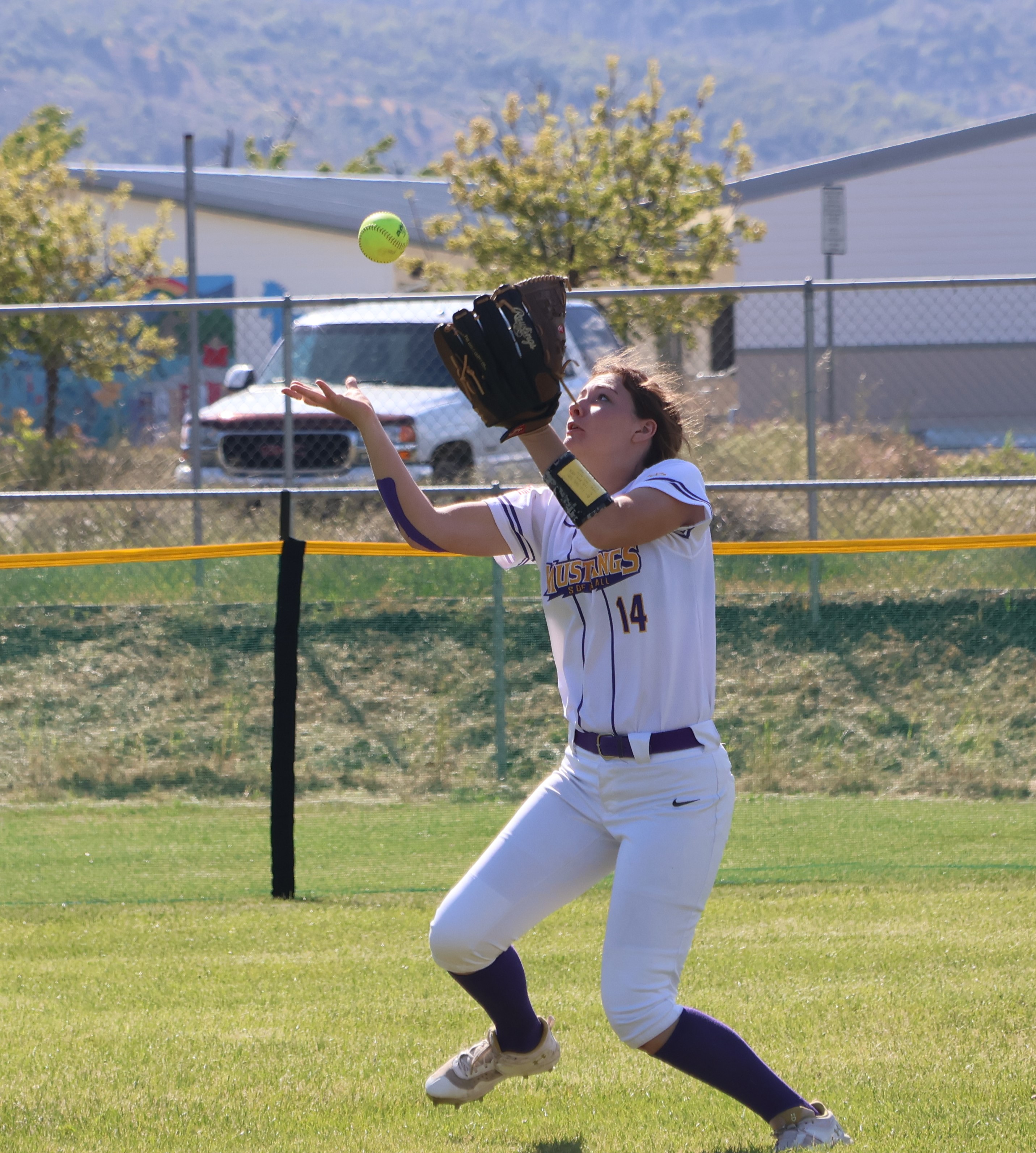Middletown left fielder Cadence Henry had the ball pop out of her glove but still caught it after a bit of a juggling act to record the out. (Photos by Brian Sumpter)