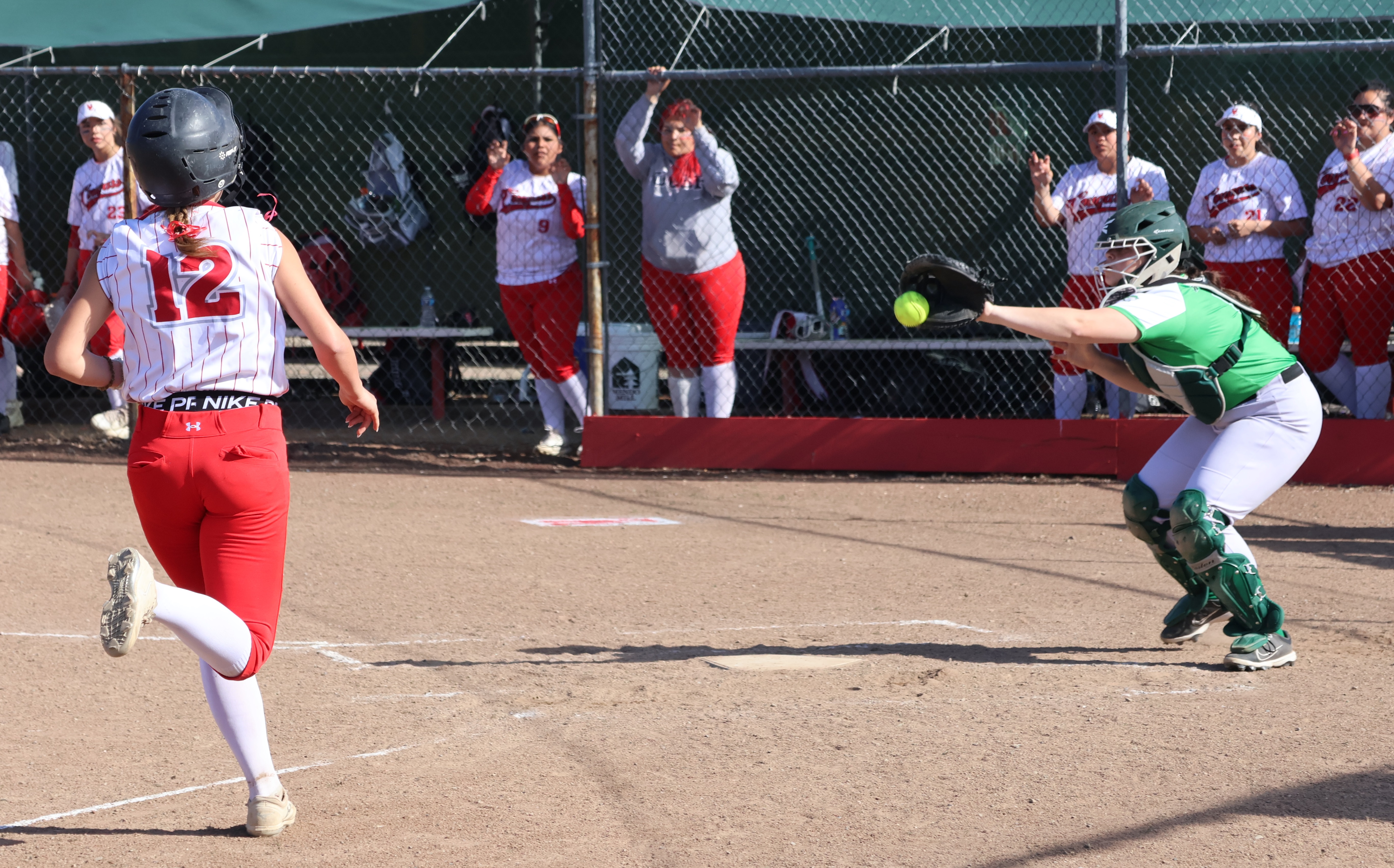 The throw home arrived in plenty of time but Calistoga's catcher dropped the ball for an error as Nya Marcks bears down on the plate. Marcks tripled to deep center field and scored on the play. (Photos by Brian Sumpter)