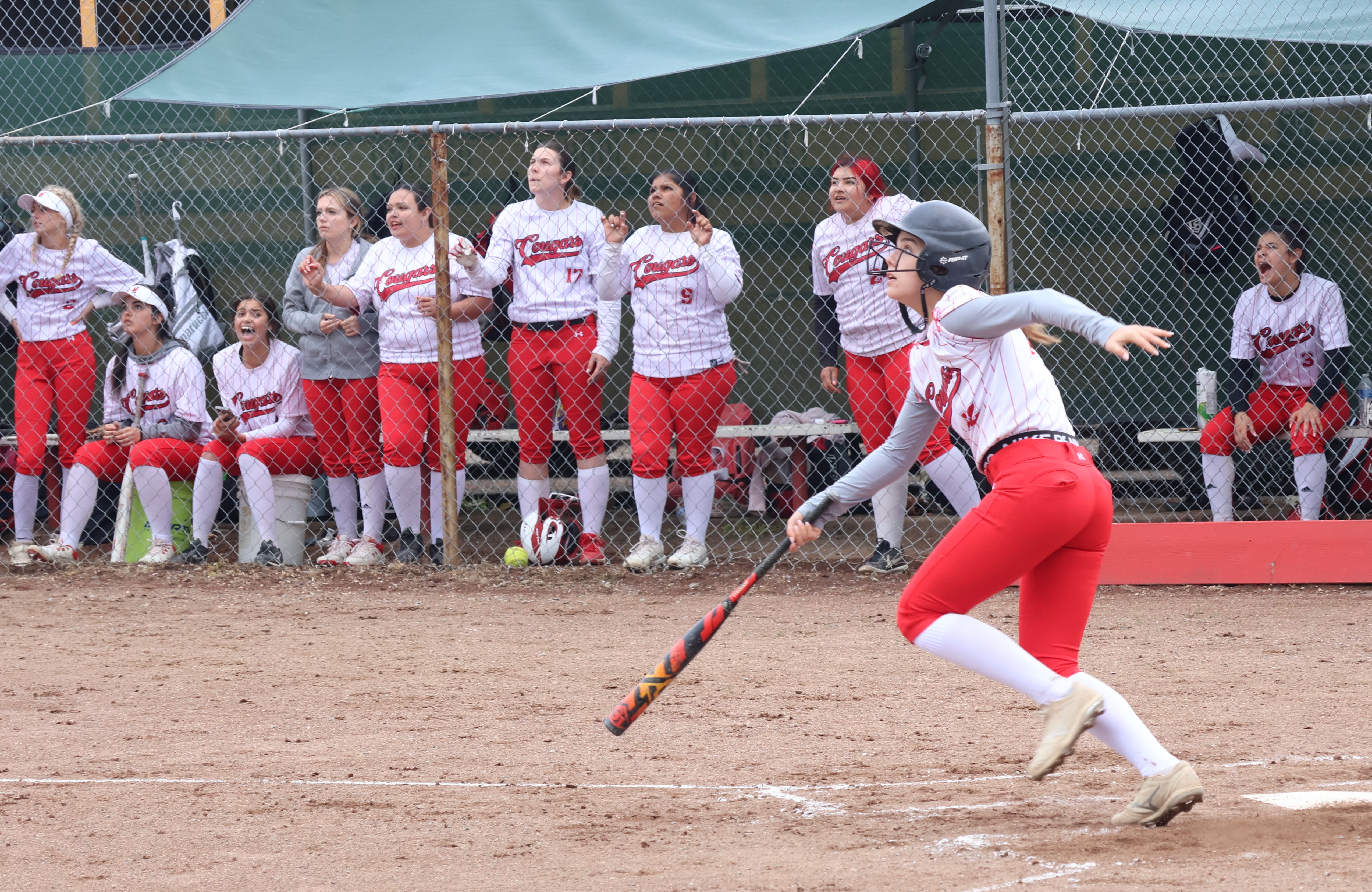 Nya Marcks and her Upper Lake teammates on the bench follow the flight of her flyball into center field that was caught for an out in the bottom of the third inning. (Photos by Brian Sumpter)