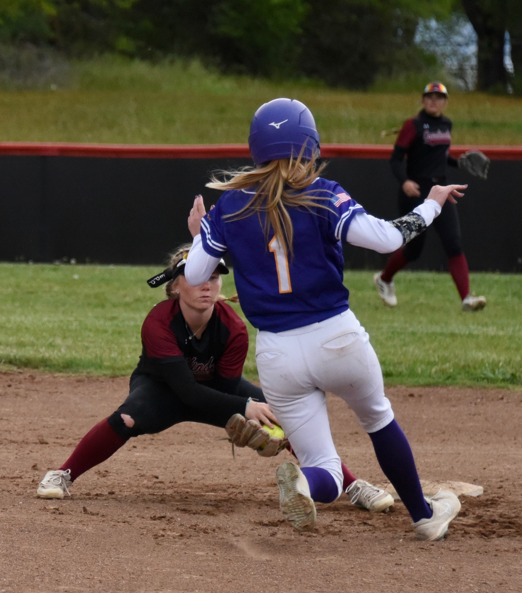 Clear Lake shortstop Amber Smart takes the throw from catcher Karsyn Greer before tagging out Middletown's Cora Holley on an attempted steal of second base. Karsyn threw out two Mustangs runners trying to steal second in the game. (Photos courtesy of Trett Bishop)
