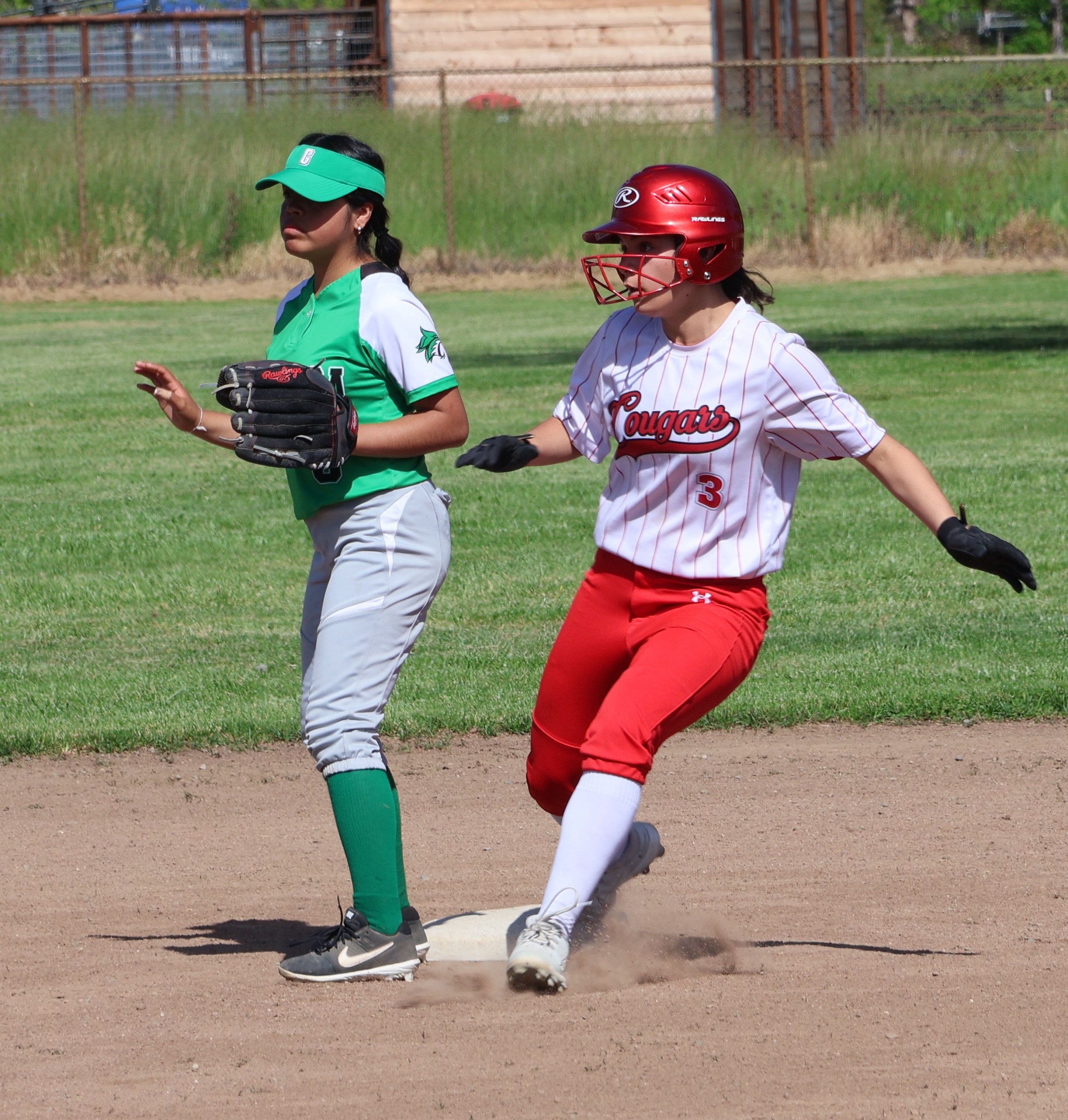Upper Lake's Maddy Young checks the location of the ball after pulling into second base with a double in the bottom of the first inning. Young's extra-base hit knocked in the Cougars' first run of the game. (Photos by Brian Sumpter)