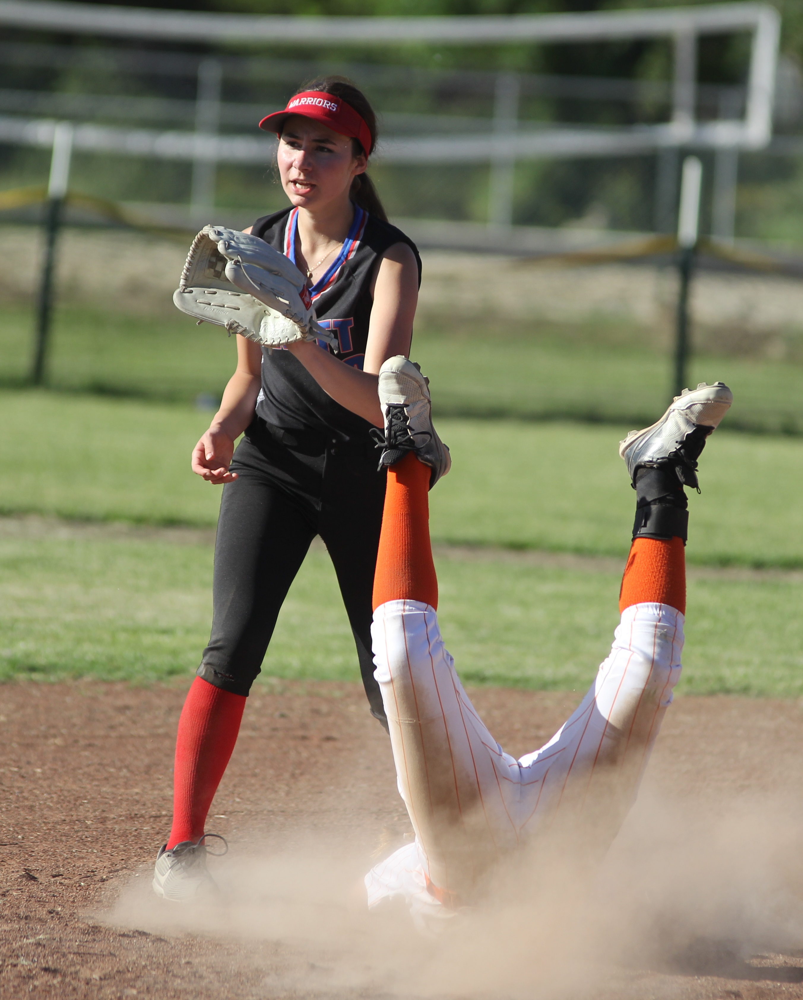 Kelseyville's Kat Wheelan plows her way into second base while advancing on a groundout in the bottom of the first inning. (Photos by Minenna Photography)