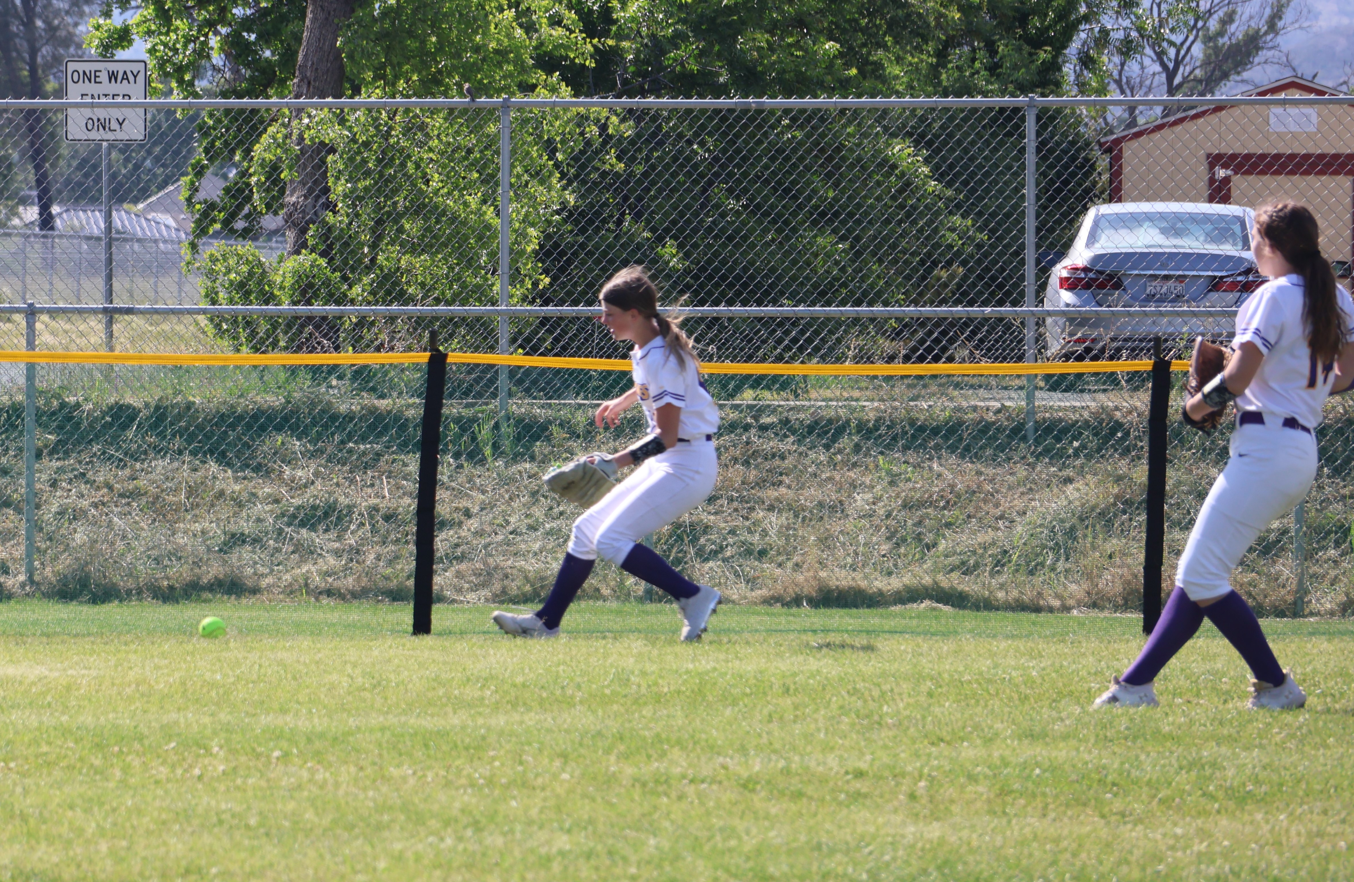 Middletown center fielder Jaylee Doris retrieves a ball at the fence on Abigail Vizcaino's two-run double for Cloverdale during a seven-run top of the second for the Eagles. Following the play is left fielder Cadence Henry. (Photos by Brian Sumpter)
