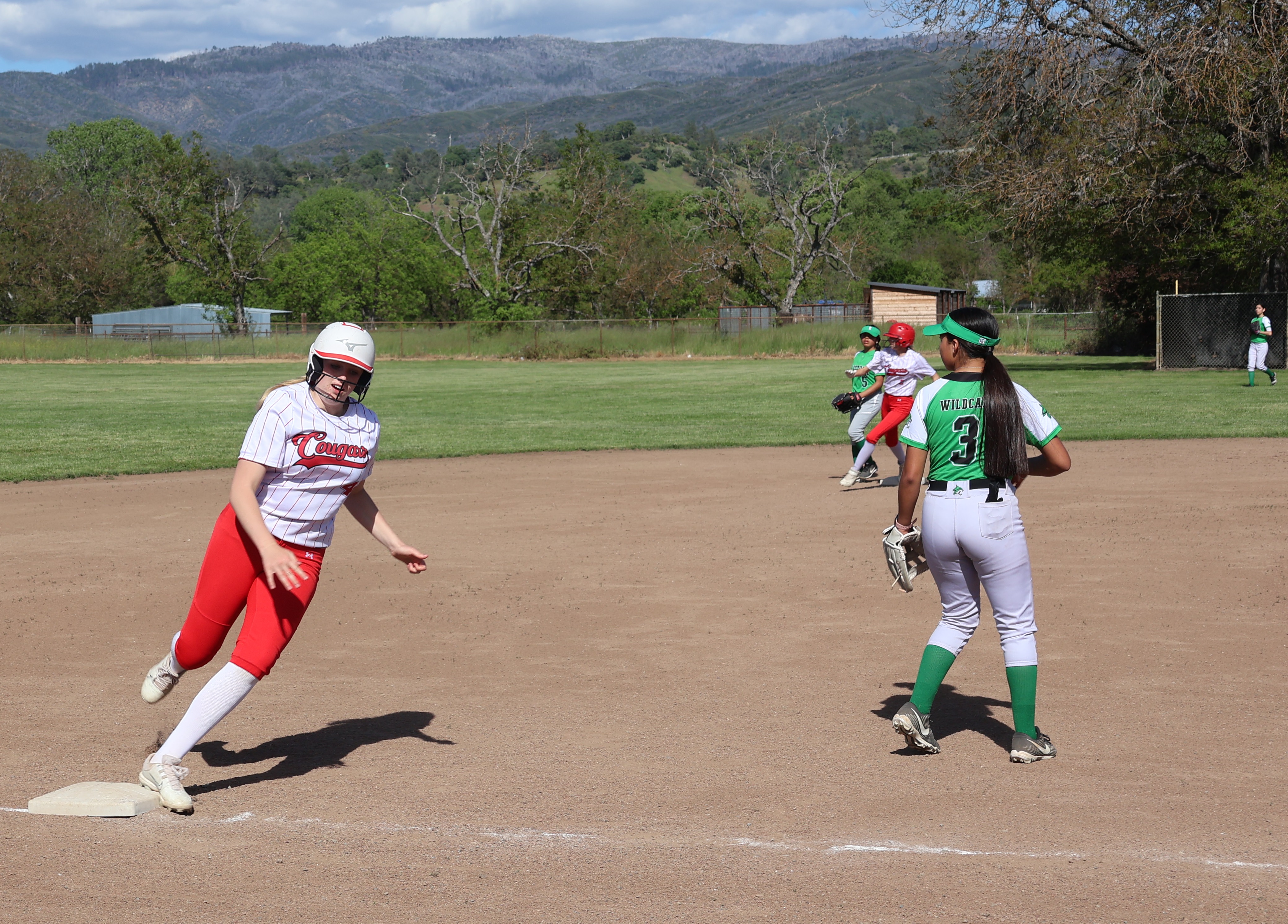 Aimee Schaefers rounds third base as Tristin Rhodes tears around second on teammate Ashlyn Wurm's double in the bottom of the second inning. Schaefers scored while Rhodes was thrown out at the plate. (Photos by Brian Sumpter)