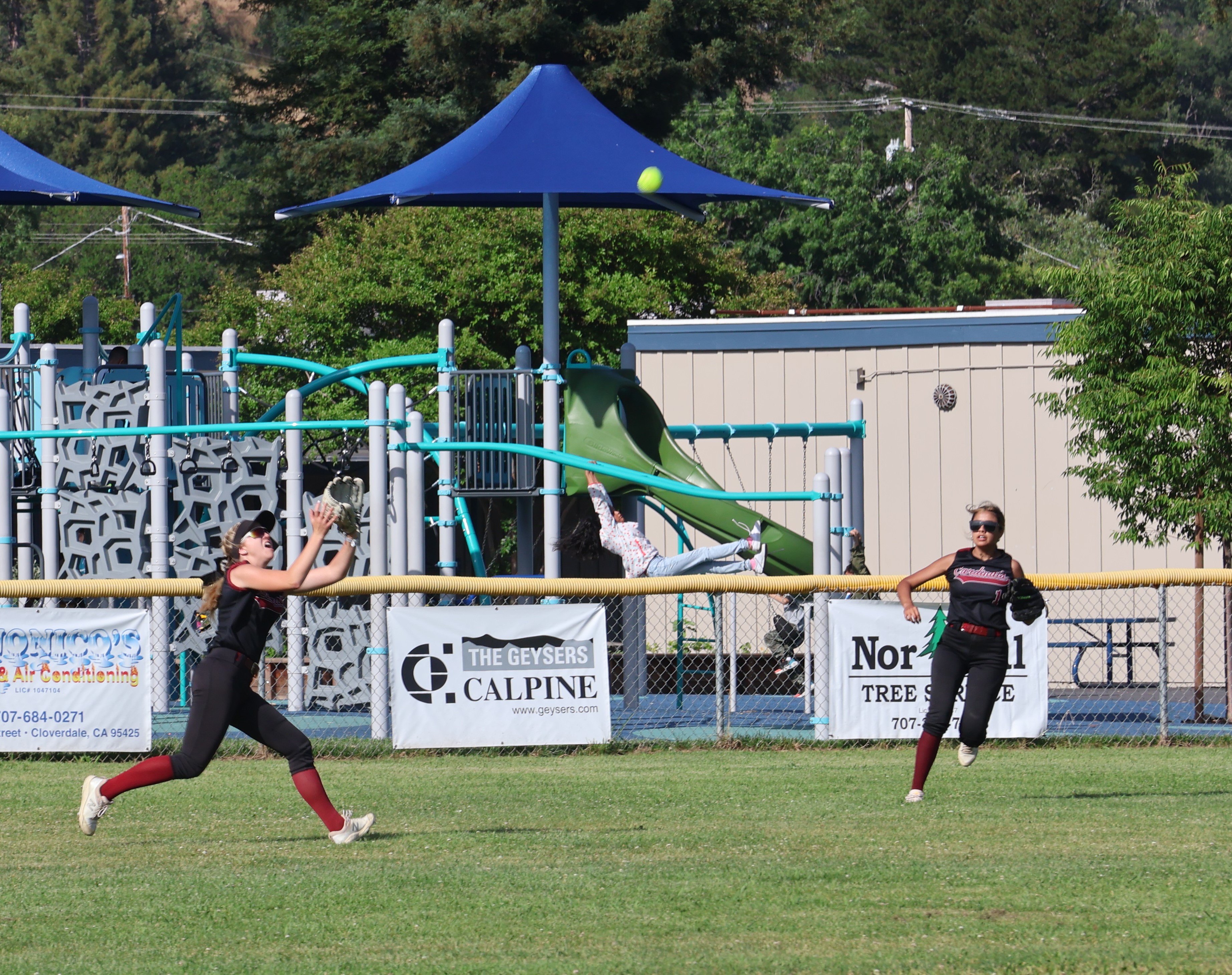 Clear Lake center fielder Sierra Bruch zeroes in on a flyball in the bottom of the second inning. She made the catch to end the inning as teammate Rubi Ford looks on. (Photos by Brian Sumpter)