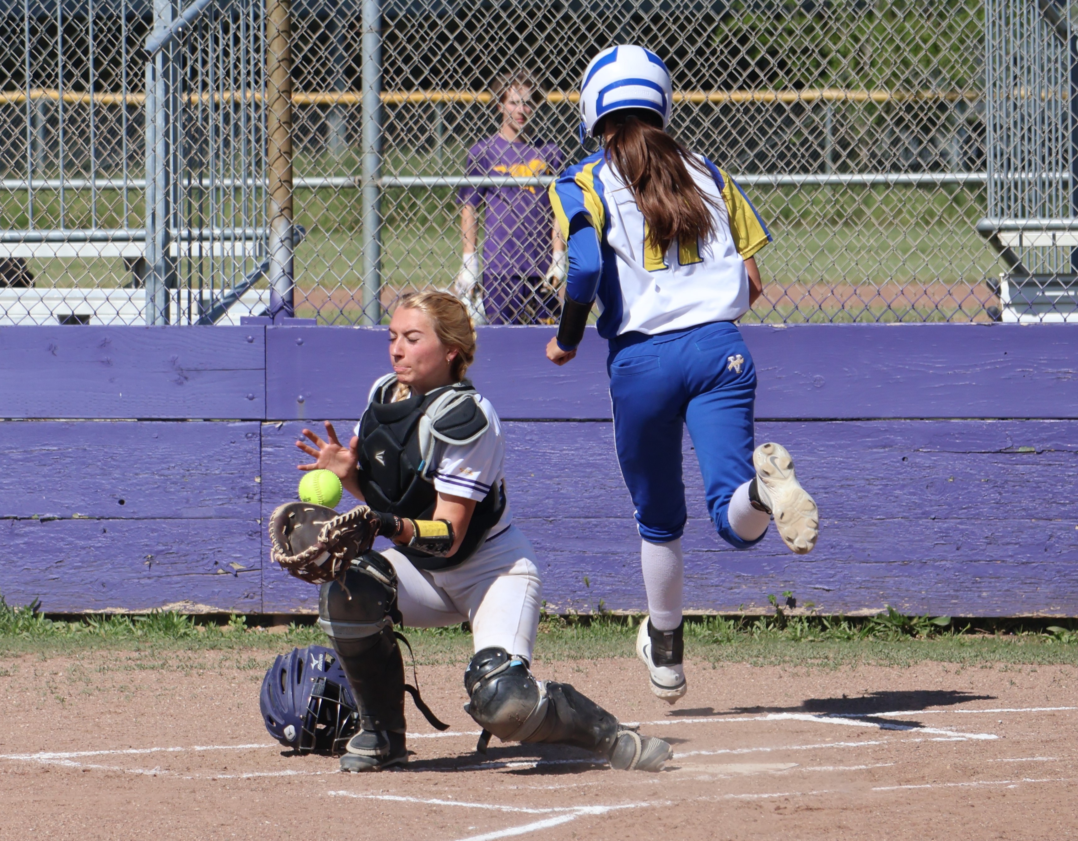 Cloverdale's Tylie Hatcher beat the throw home as Middletown's Carina Fleenor corrals the ball. Hatcher went 3-for-4 with two RBIs for the Eagles in a 12-1 win over the Mustangs. (Photos by Brian Sumpter)