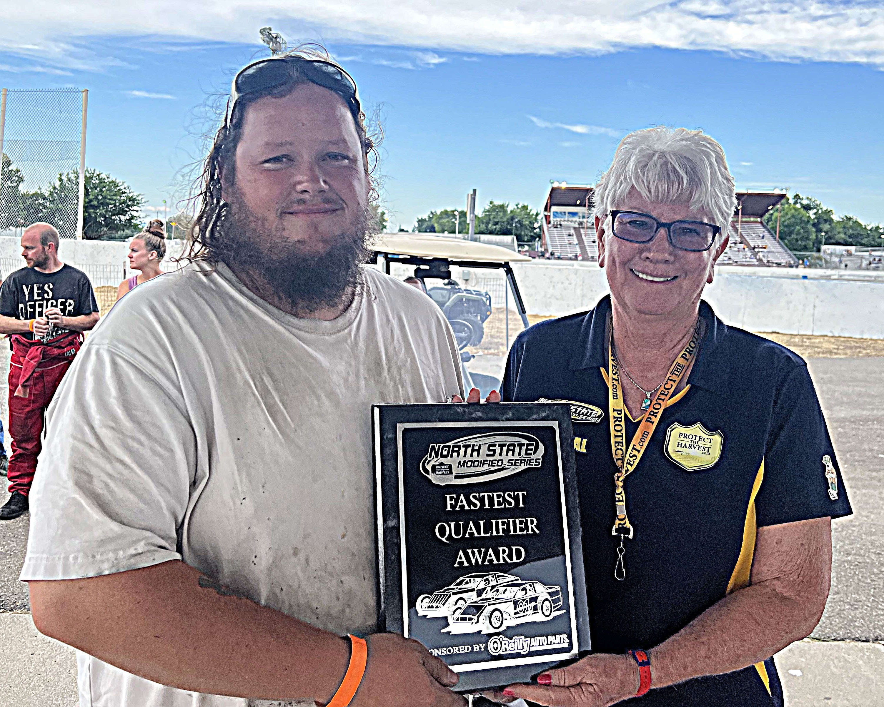 Nadine Strauss presents Ian Elliott of Lakeport with the O'Reilly's Auto Parts Fastest Qualifier Award on Saturday night at the Shasta Speedway in Anderson. (Courtesy photos)
