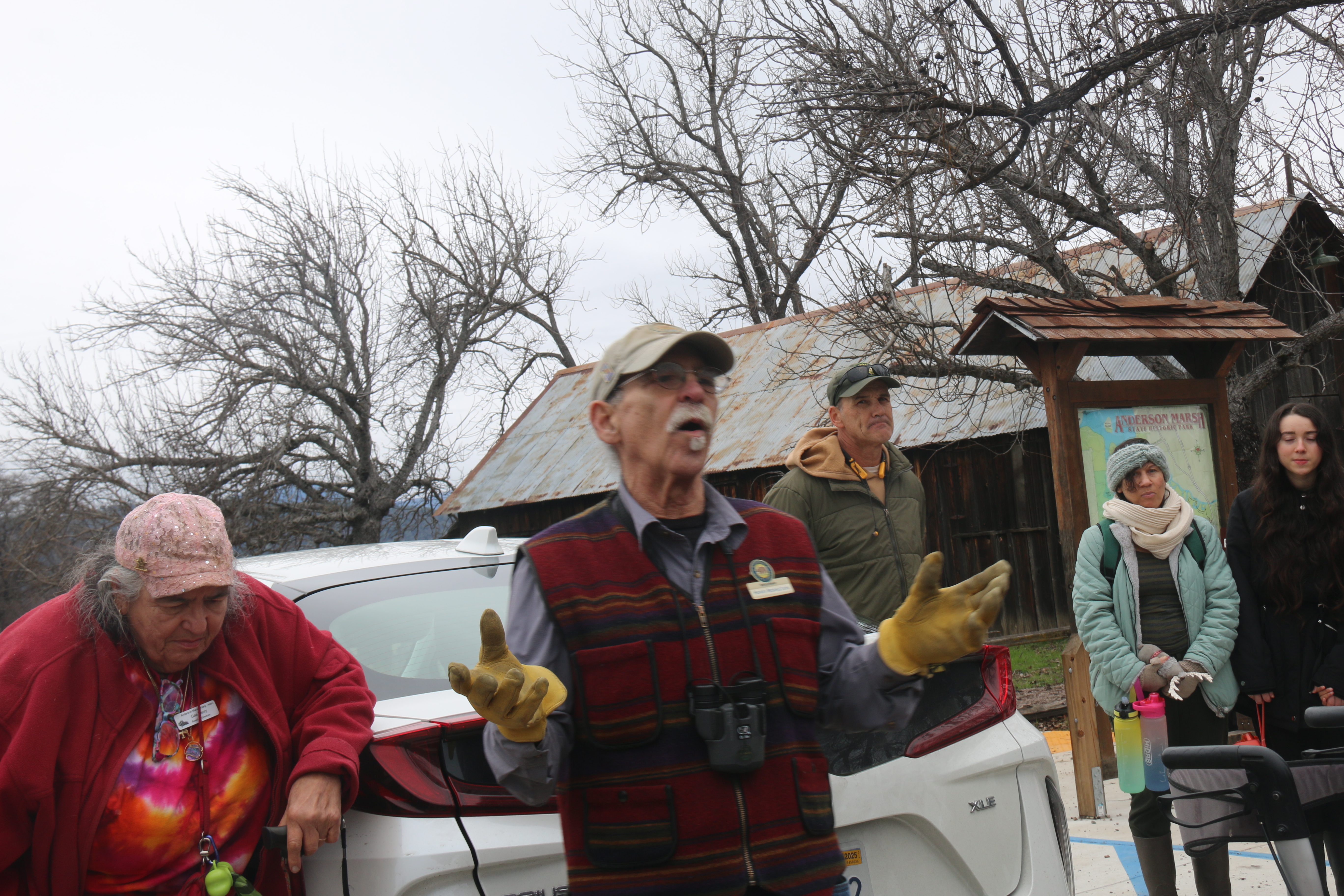 Left, Gae Henry, Anderson MarshInterpretive assoc. board member, and a docent for the Park, and right, Henry Bornstein, Anderson Marsh Interpretive assoc. board member, and a volunteer docent, address hikers before departing for First Day Hike event, New Years Day, 2025, Clearlake.