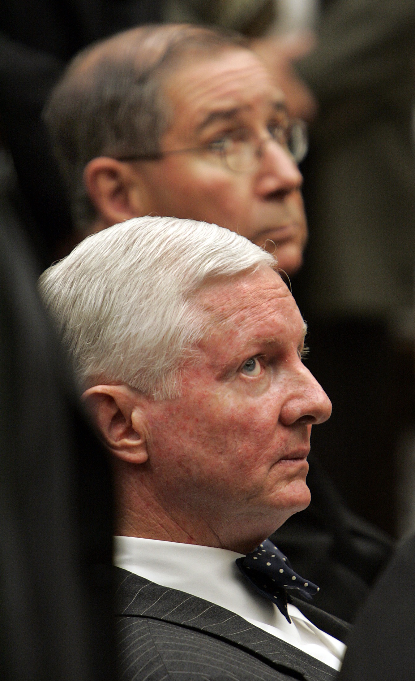 Attorney J. Michael Hennigan, front, and Cardinal Roger Mahony, in Judge Haley J. Fromholz's courtroom during the settlement conference about alleged victims of abuse by clergy members on July 16, 2007 in Los Angeles, California