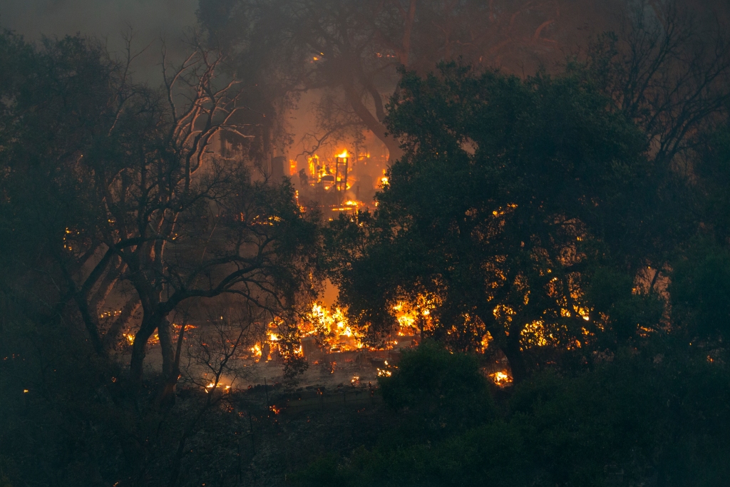 A structure burns during the Carmel Fire