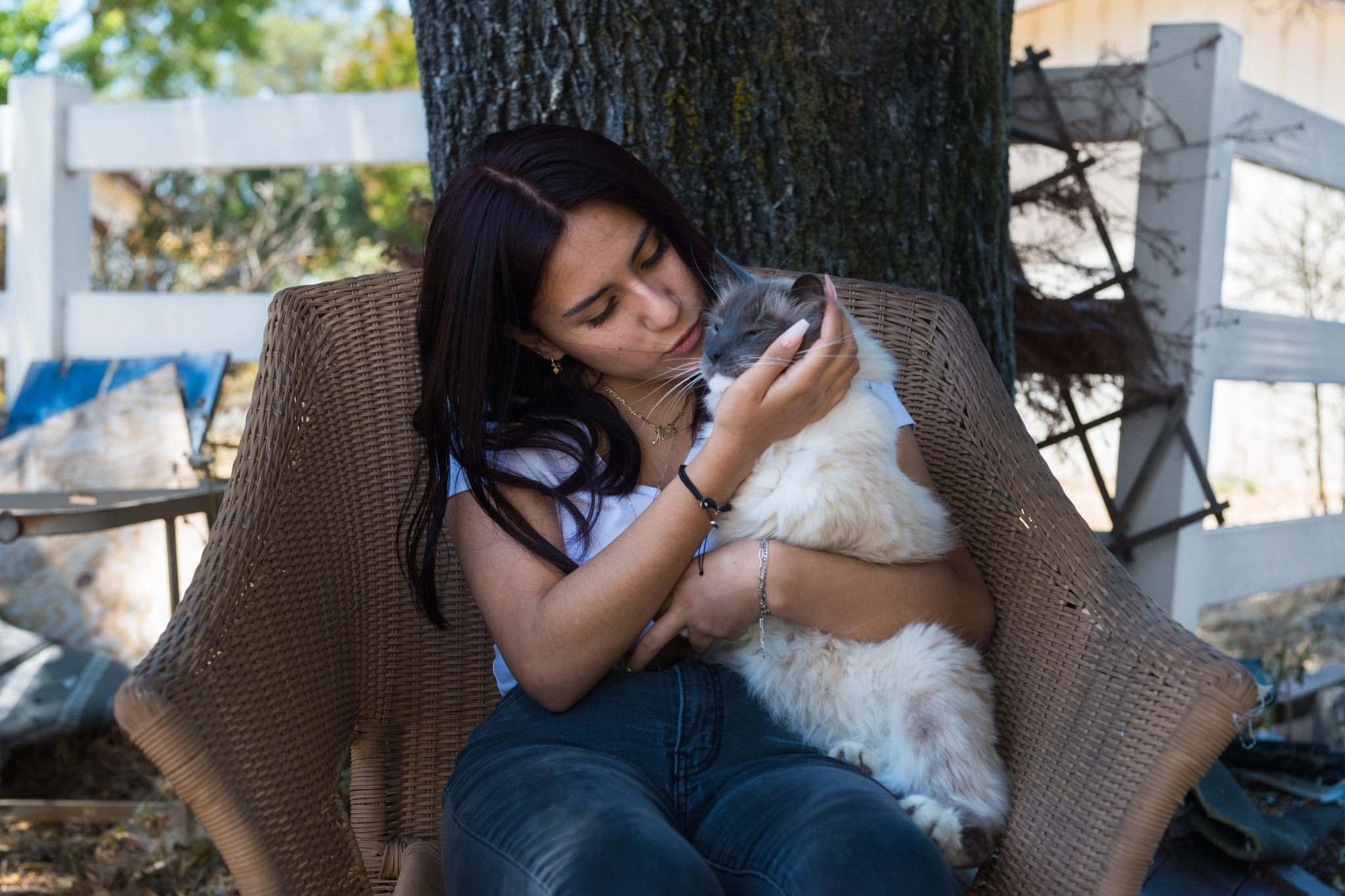 Maia Bravo with her cat, Misi, who was found 15 days after the family fled a wildfire.
