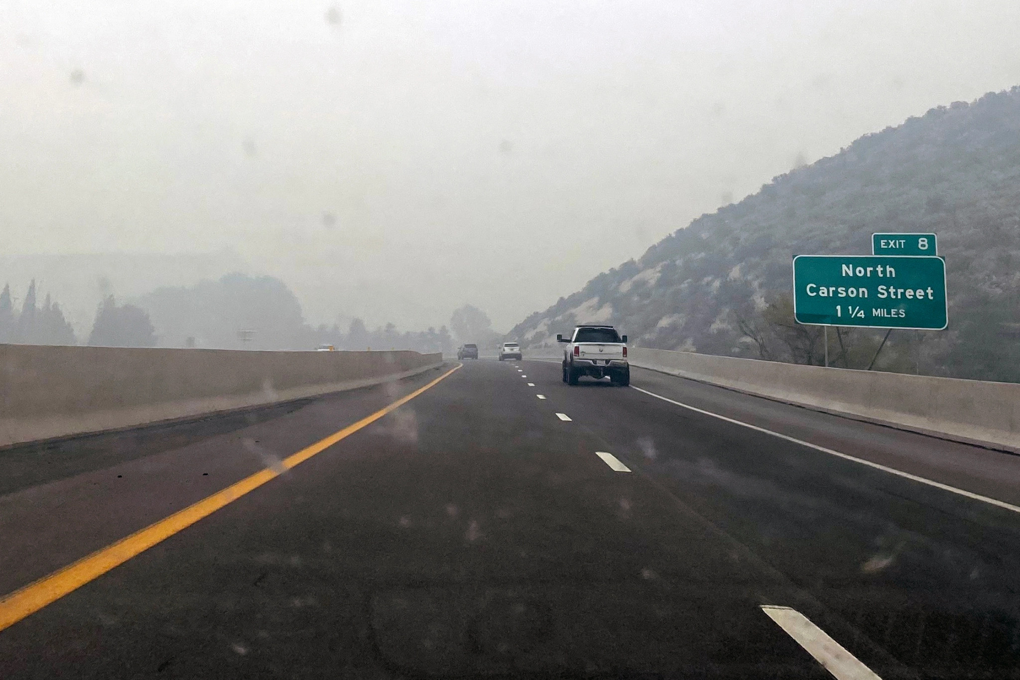 Smoke from wildfires and dust storms cloud the skies near Gardnerville, Nev.