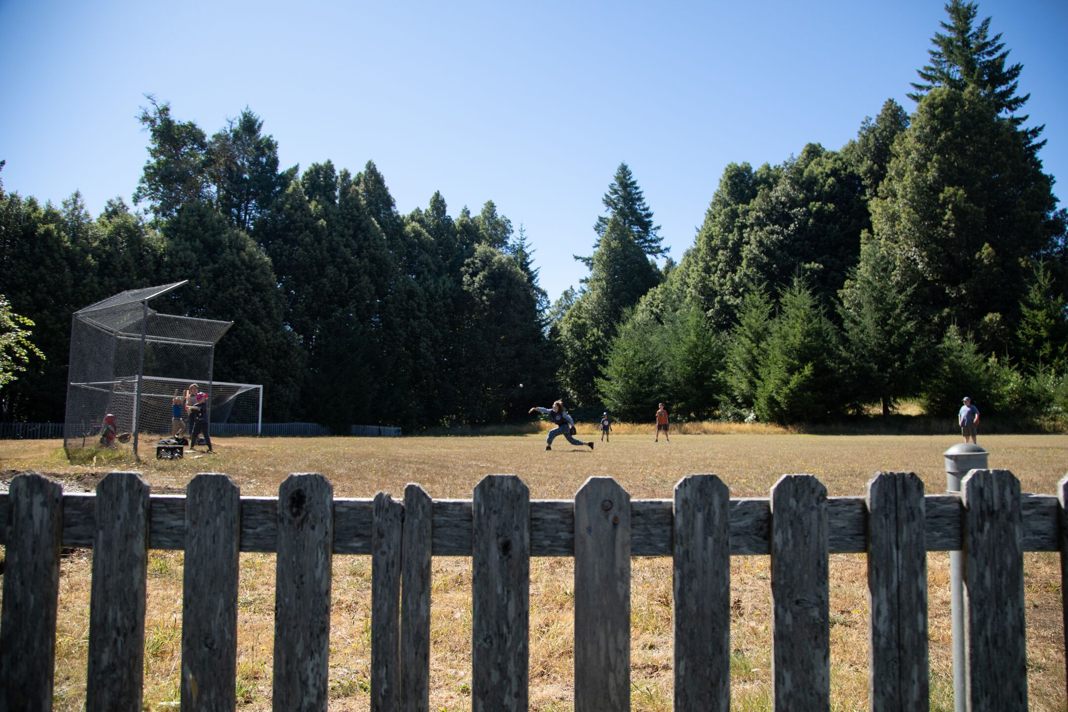 Students play baseball during a break at Kneeland Elementary School, which had an average daily attendance of 12 students two years ago.