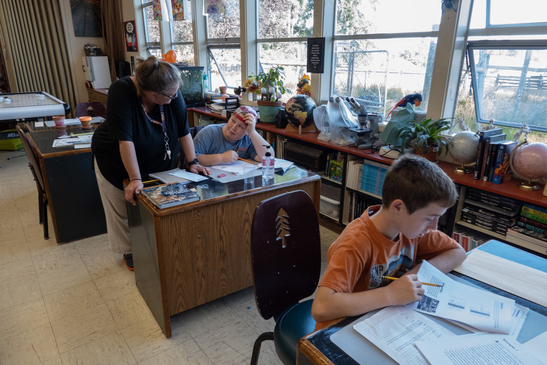 Supt. Greta Turney, who also is a teacher, helps Kneeland Elementary sixth-grader Asha Quinlan in August.