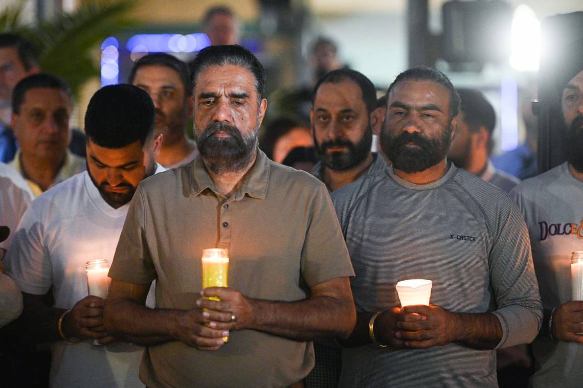 Mourners gather in Merced's Bob Hart Square on Thursday to remember four family members who were kidnapped at gunpoint and murdered.