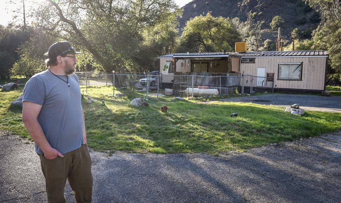 Luke Harbin takes a look at his mother's mobile home while getting ready to move out of the park on Sunday, March 13, 2022.