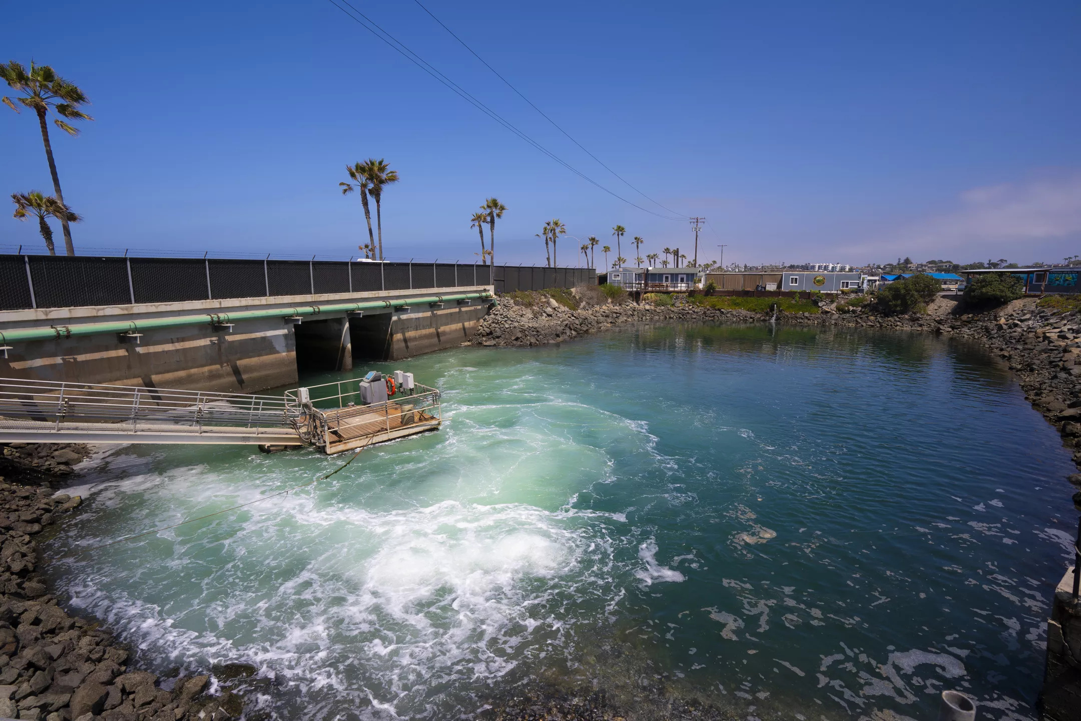 Brine water exiting from Carlsbad Desalination Plant is further mixed in with ocean water at the discharge pond before finally exiting out toward the ocean jetty.
