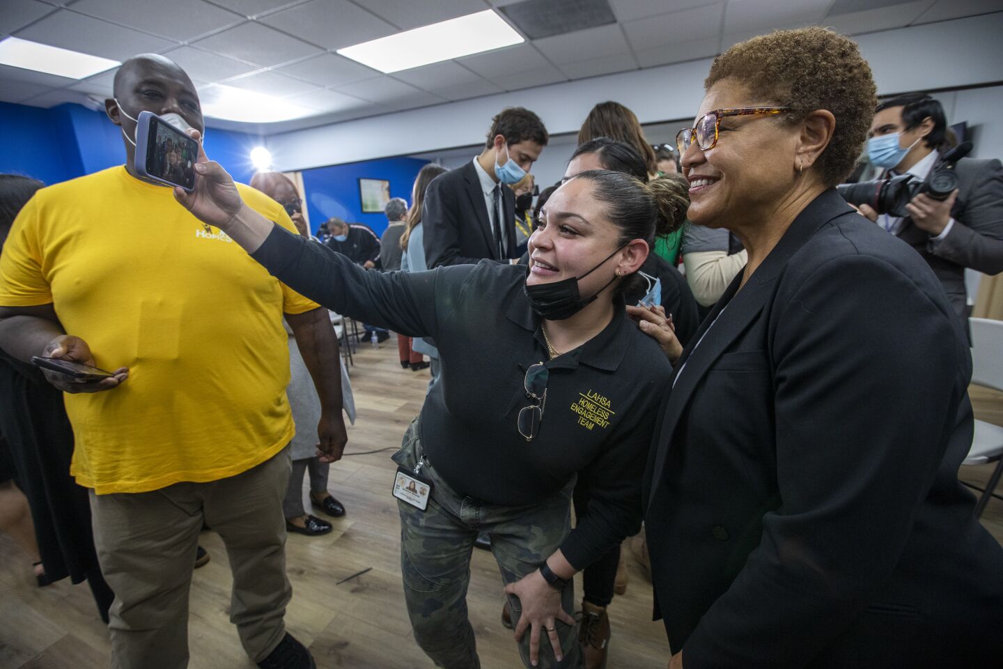 Los Angele Mayor Karen Bass, right, spoke during a press conference at The People Concern on Wednesday, Dec. 21, 2022, in Los Angeles. After the press conference workers from various local agencies took selfies with the new mayor. 
