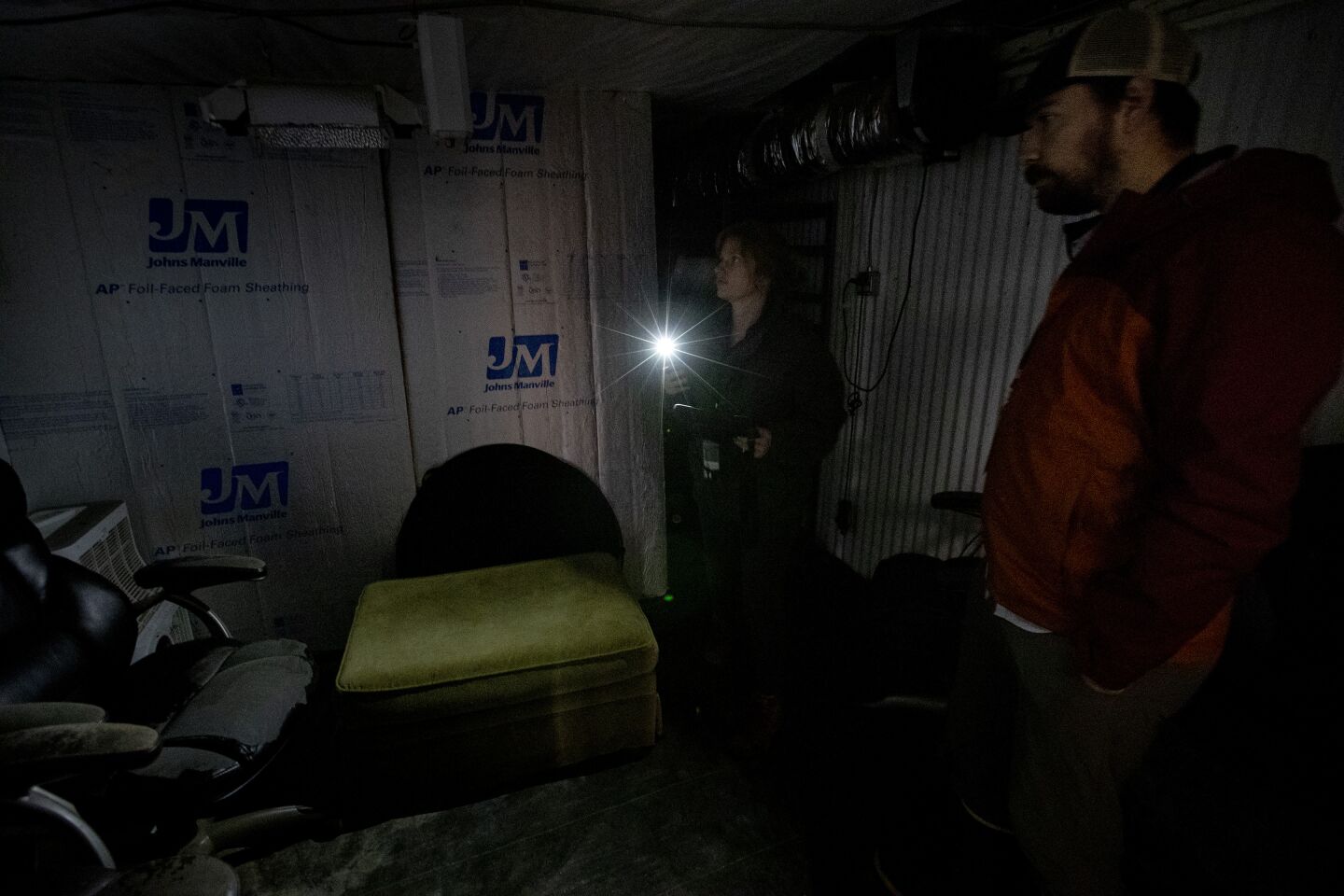 California cannabis control inspectors Eric LeBlanc and Laura Powell look over a storage room at Huckleberry Hill Farms.