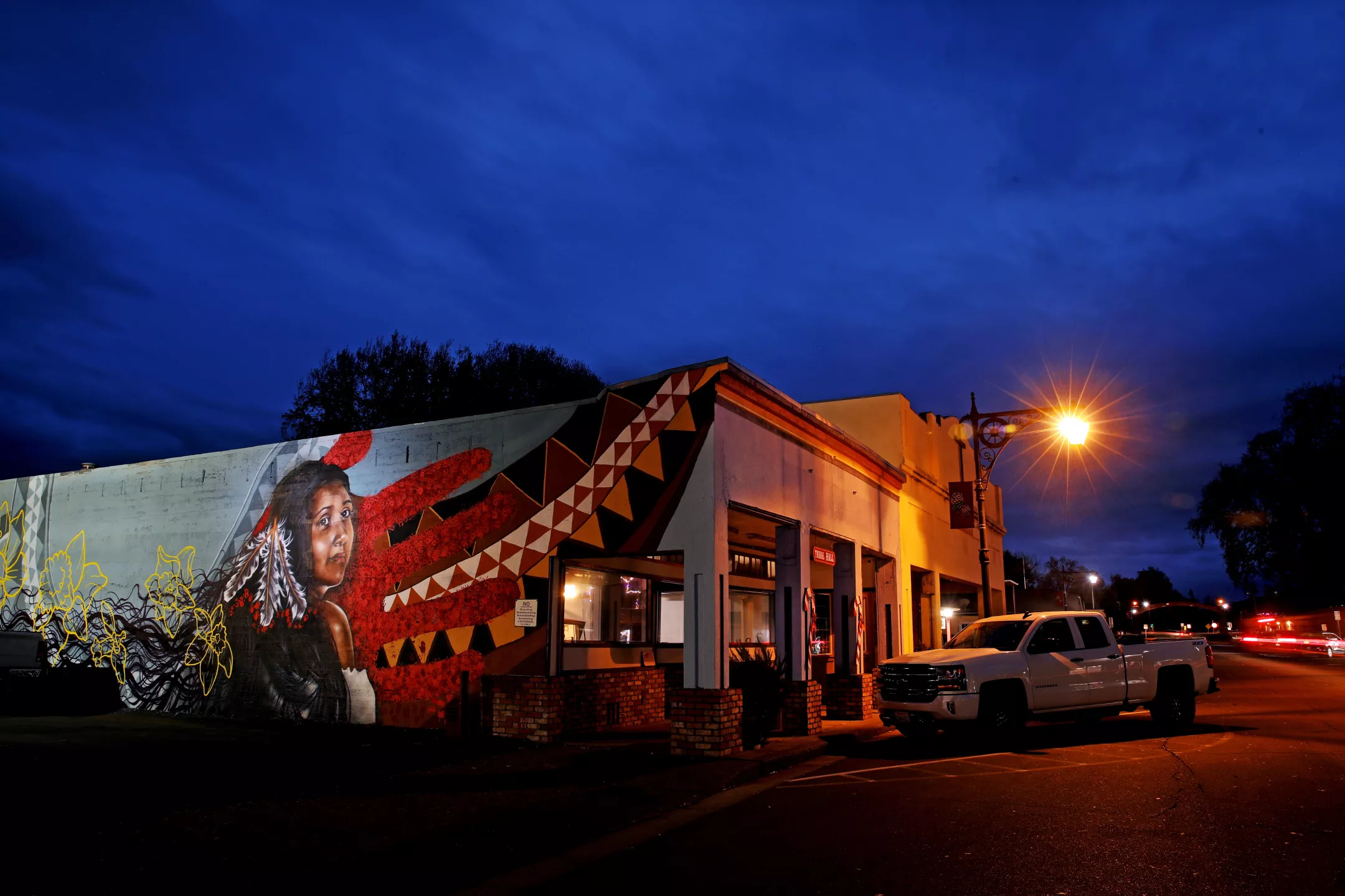 A mural honoring Vanessa Yvette Niko, of the Habematolel Pomo Tribe, adorns an exterior wall of Habematolel Hall along Main Street in Upper Lake.