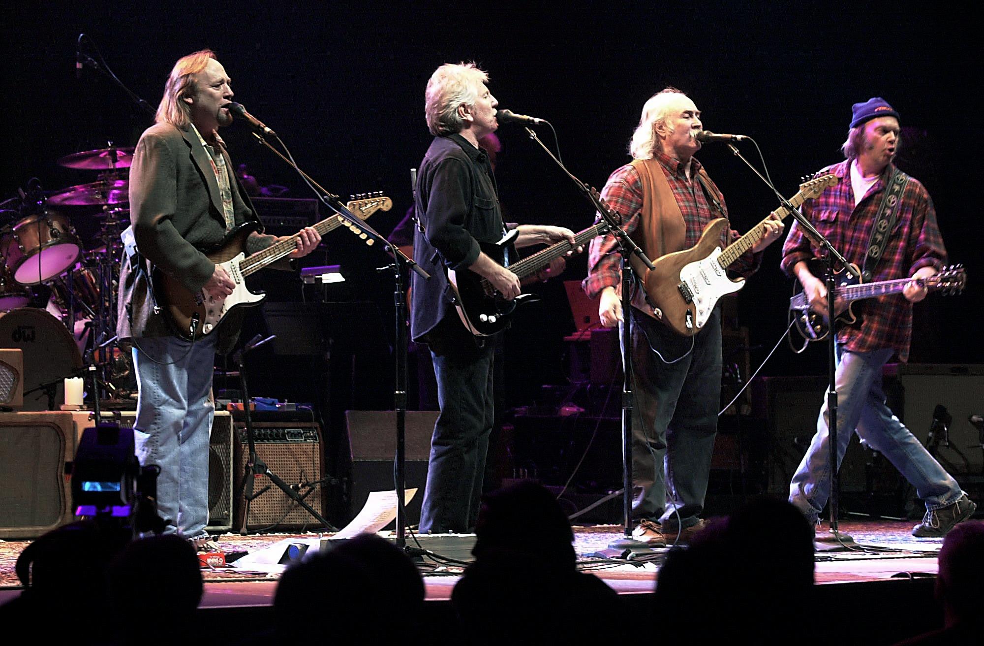 From left, Stephen Stills, Graham Nash, David Crosby and Neil Young perform Jan. 24, 2000 for the first time since 1974 at the Palace of Auburn Hill, Mich.