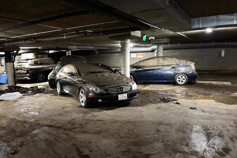 Cars parked on a subterranean level of a Hancock Park condo building's garage were damaged during a flood of the facility on Jan. 9 after heavy rains hit Los Angeles.