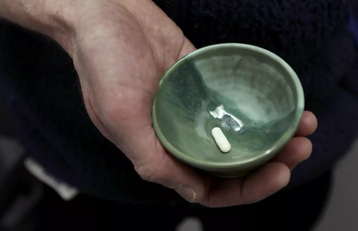 Dr. Keith Heinzerling holds a psilocybin capsule at the Pacific Neuroscience Institute.