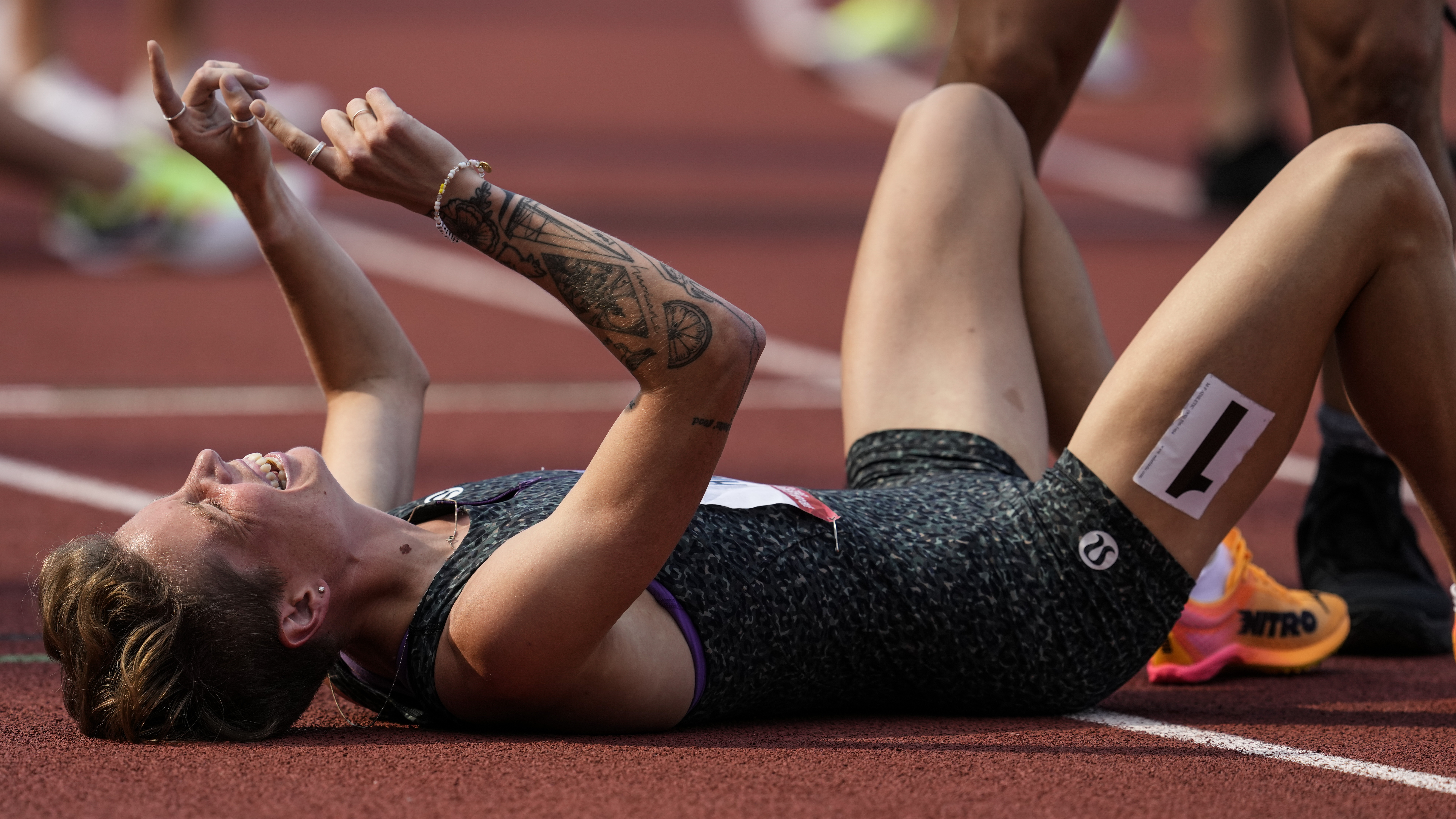 Aptos native Nikki Hiltz celebrates after winning the women's 1,500-meter final during the U.S. Track and Field Olympic Team Trials on Sunday in Eugene, Oregon. (George Walker IV - The Associated Press)