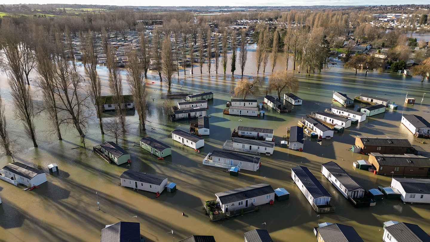 caravans in Northampton, England, surrounded by floodwater