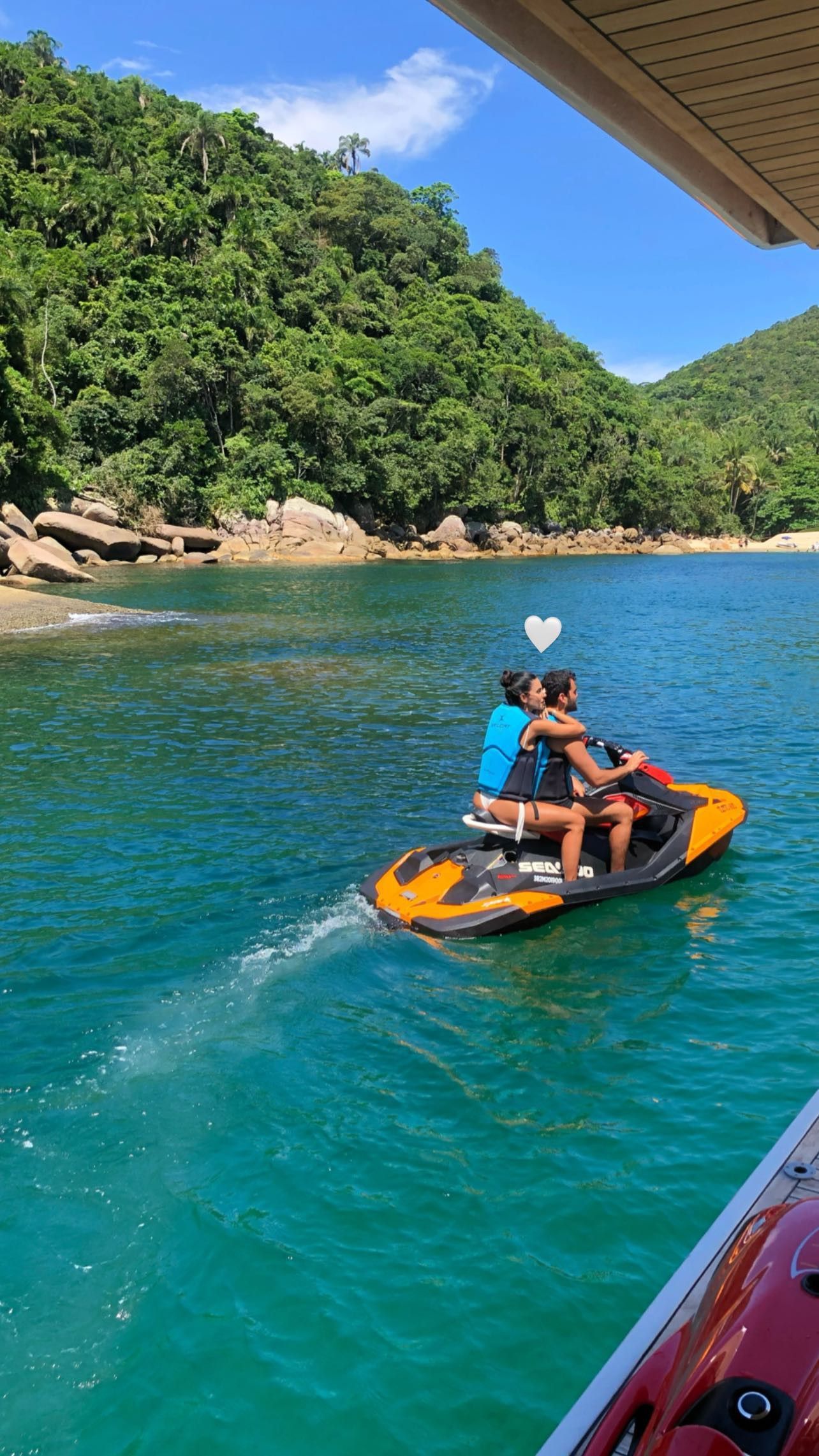 lovers on a water motocycle cruise