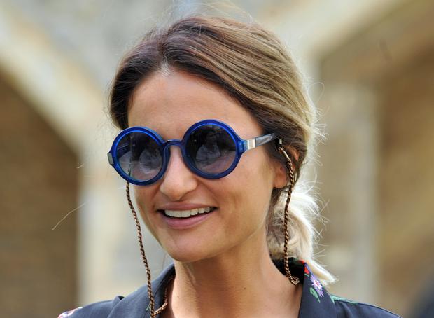 Natasha Shishmanian smiling in goggle sunglasses