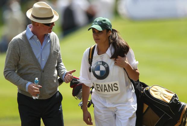 Natasha Shishmanian and her husband on a golf course