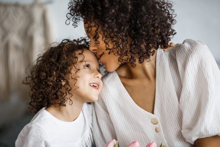 mom showing love and care to her daughter