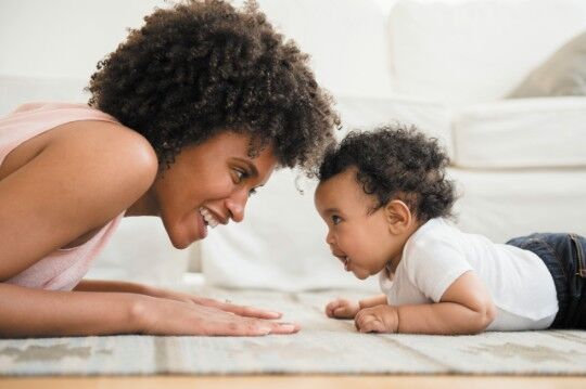 mom and her toddler playing