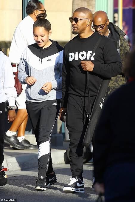 Annalise Bishop and Jamie Foxx walking the street