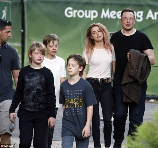 Elon Musk taking a walk with his family, including Saxon Musk