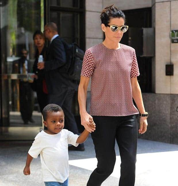 Louis Bardo Bullock and Sandra Bullock taking a walk