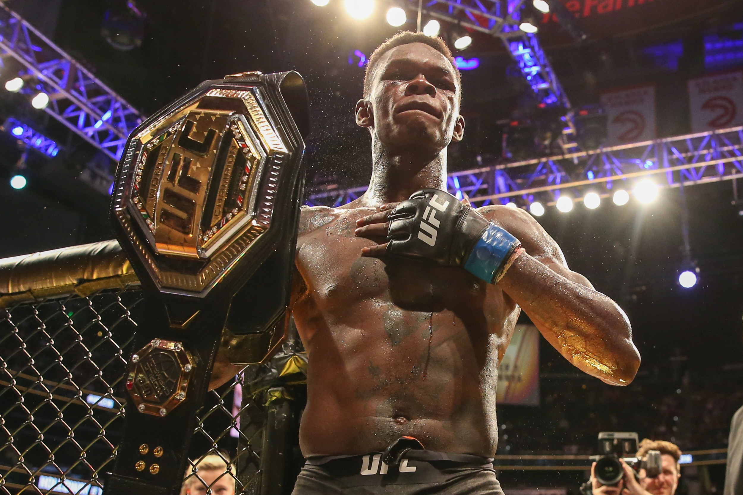 Israel Adesanya with his championship belt