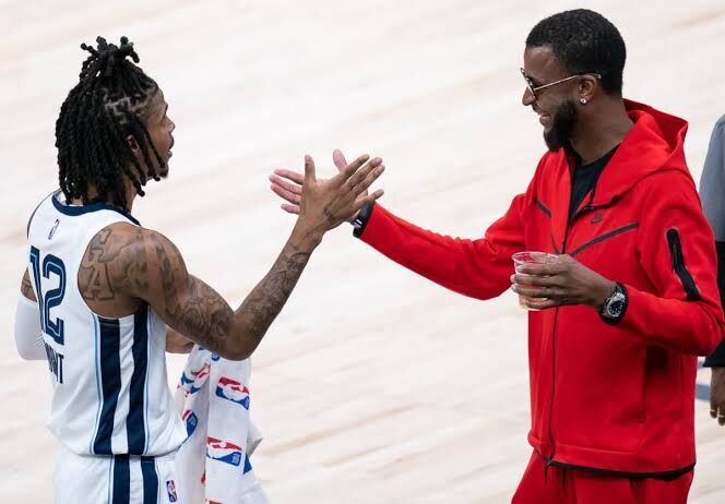 Tee Morant shaking hands with Ja Morant