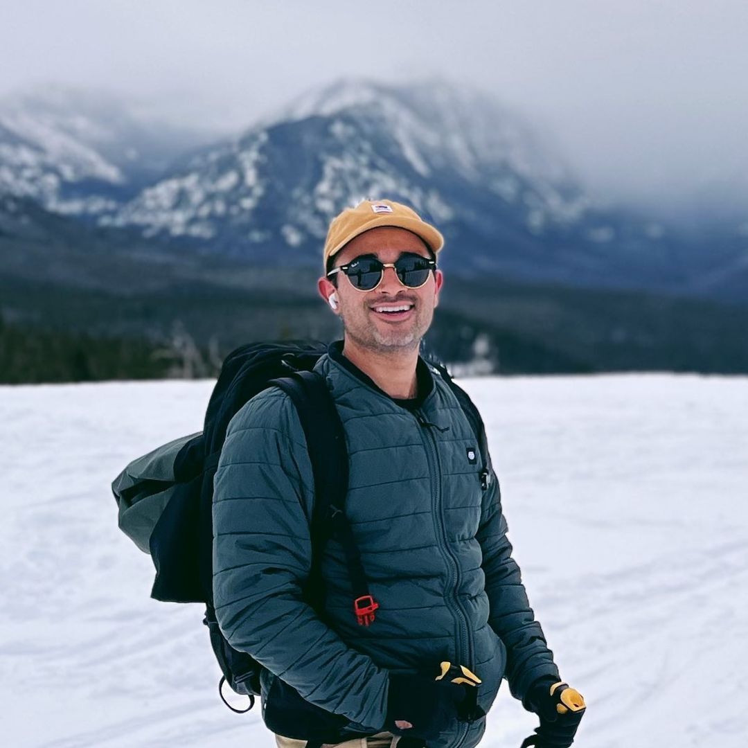 Luis Armand Garcia smiling in the snow