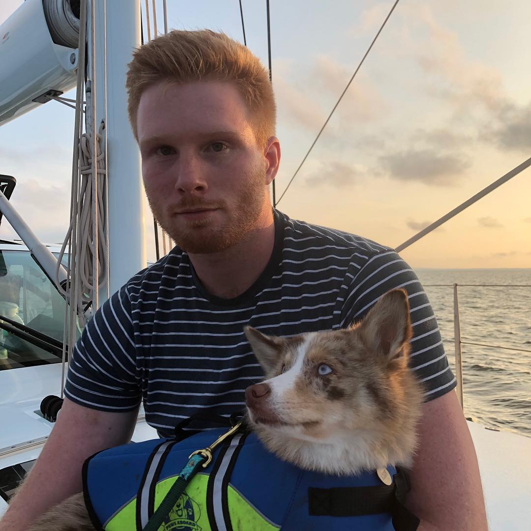 Cameron Marley Buffett on a boat with his dog