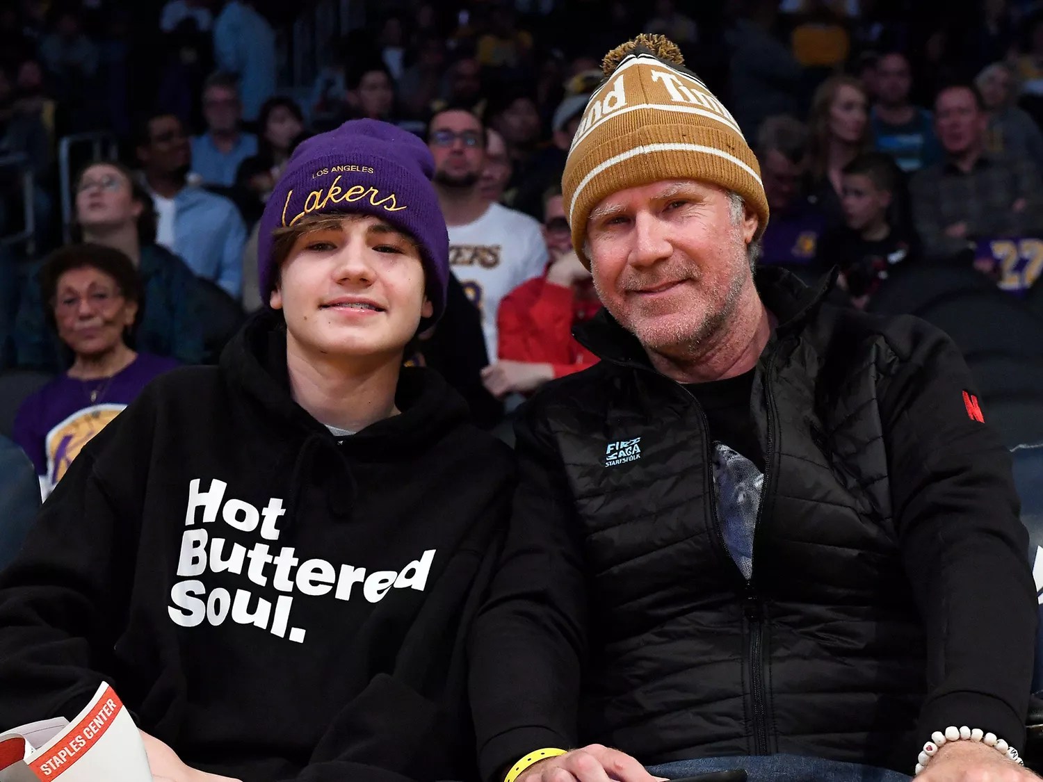 Mattitas Paulin Ferrell with his father, Will Ferrell at a game