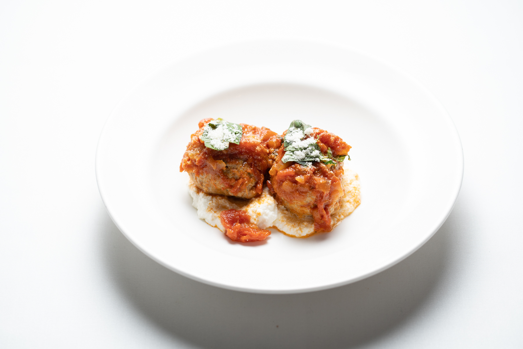 The Polpette with Parmigiano and Basil from the new Happy Hour menu at Il Mulino New York in Boca Raton. (Il Mulino New York/Courtesy)