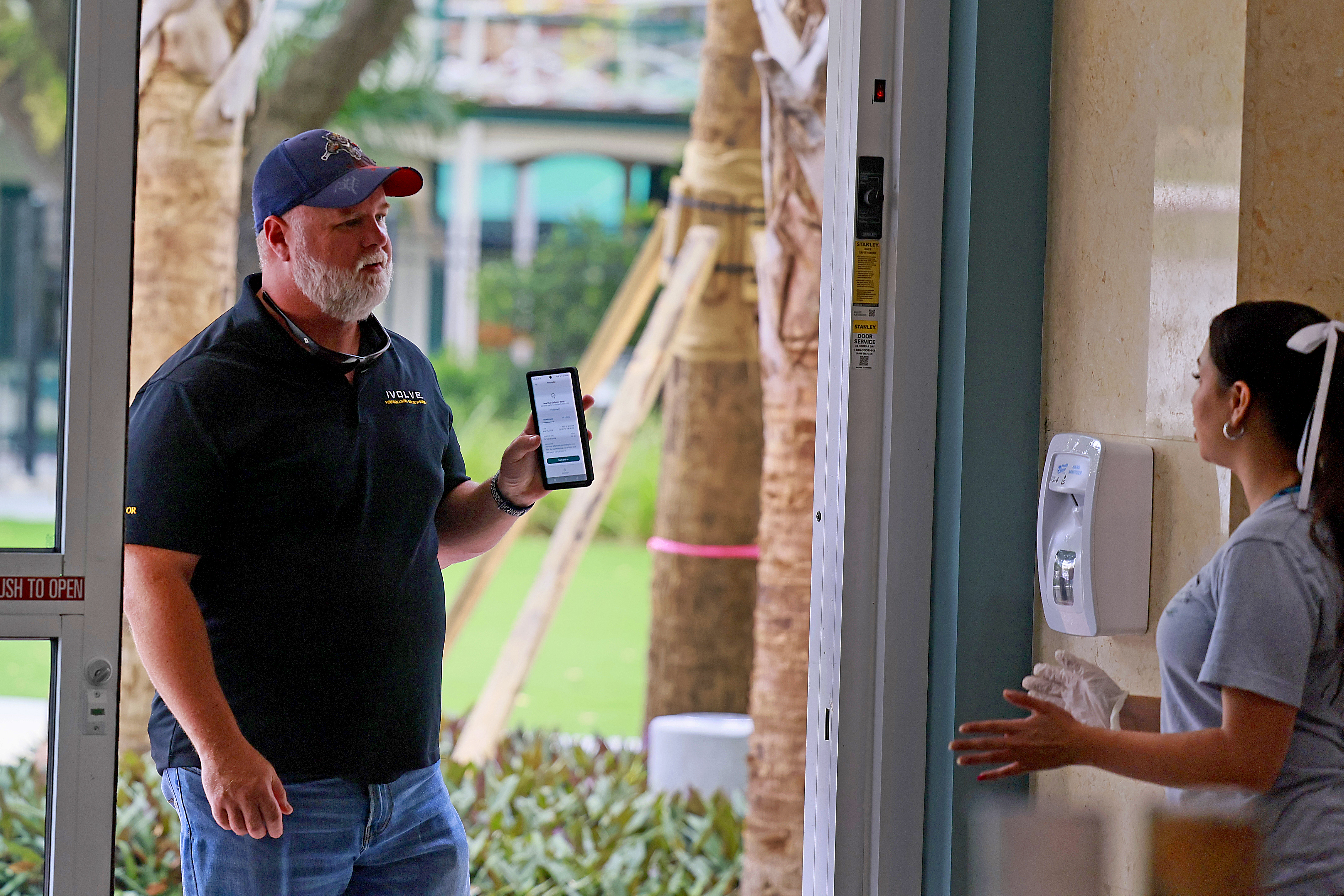 Andre Caruso uses the Too Good To Go app to pick up pastries at New River Cafe and Bakery in Fort Lauderdale. Customers must arrive during strict pickup windows, often at the end of the business day.(Mike Stocker/South Florida Sun Sentinel)