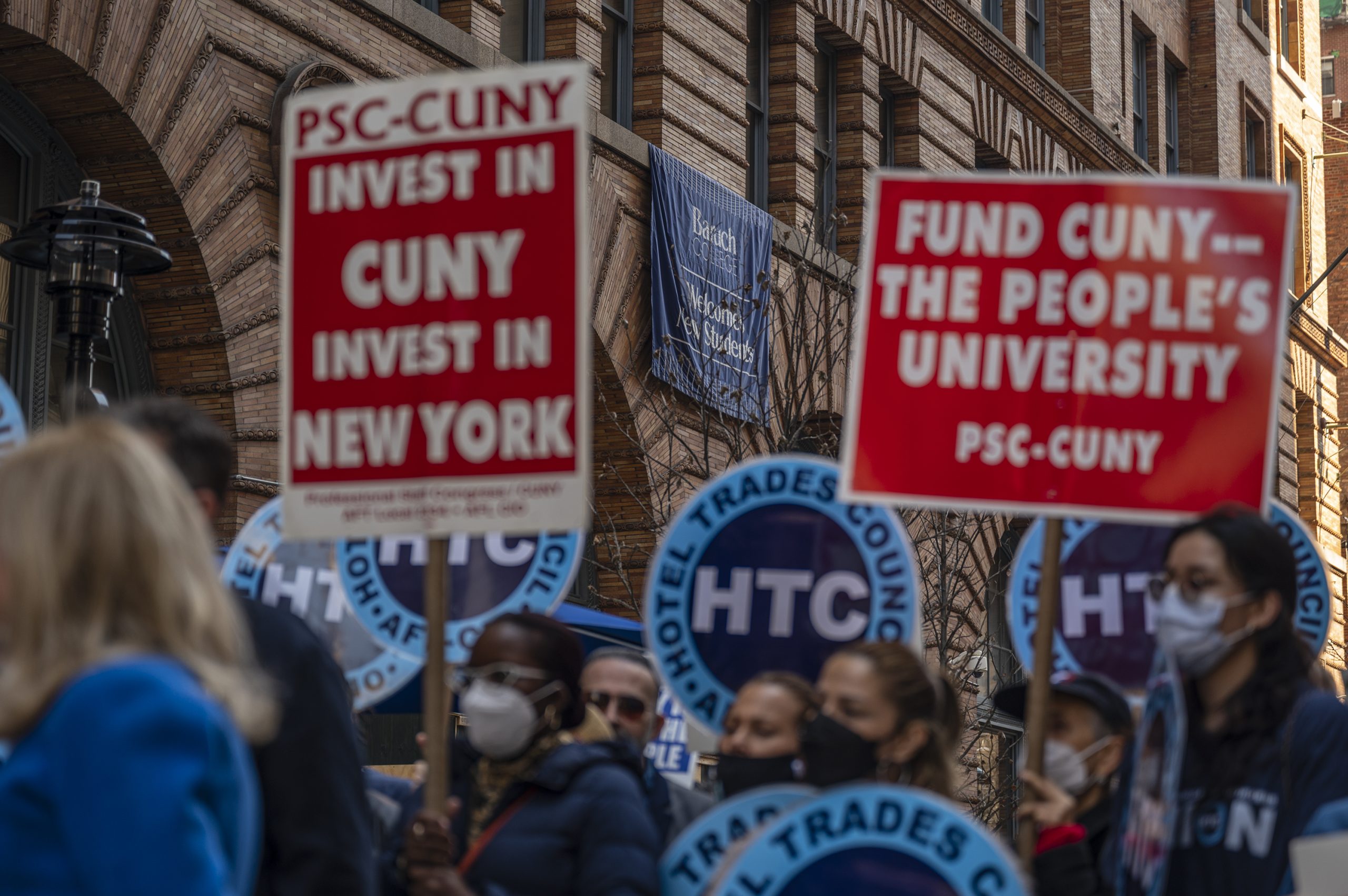 CUNY faculty union members rally outside Baruch College for free in-state tuition.