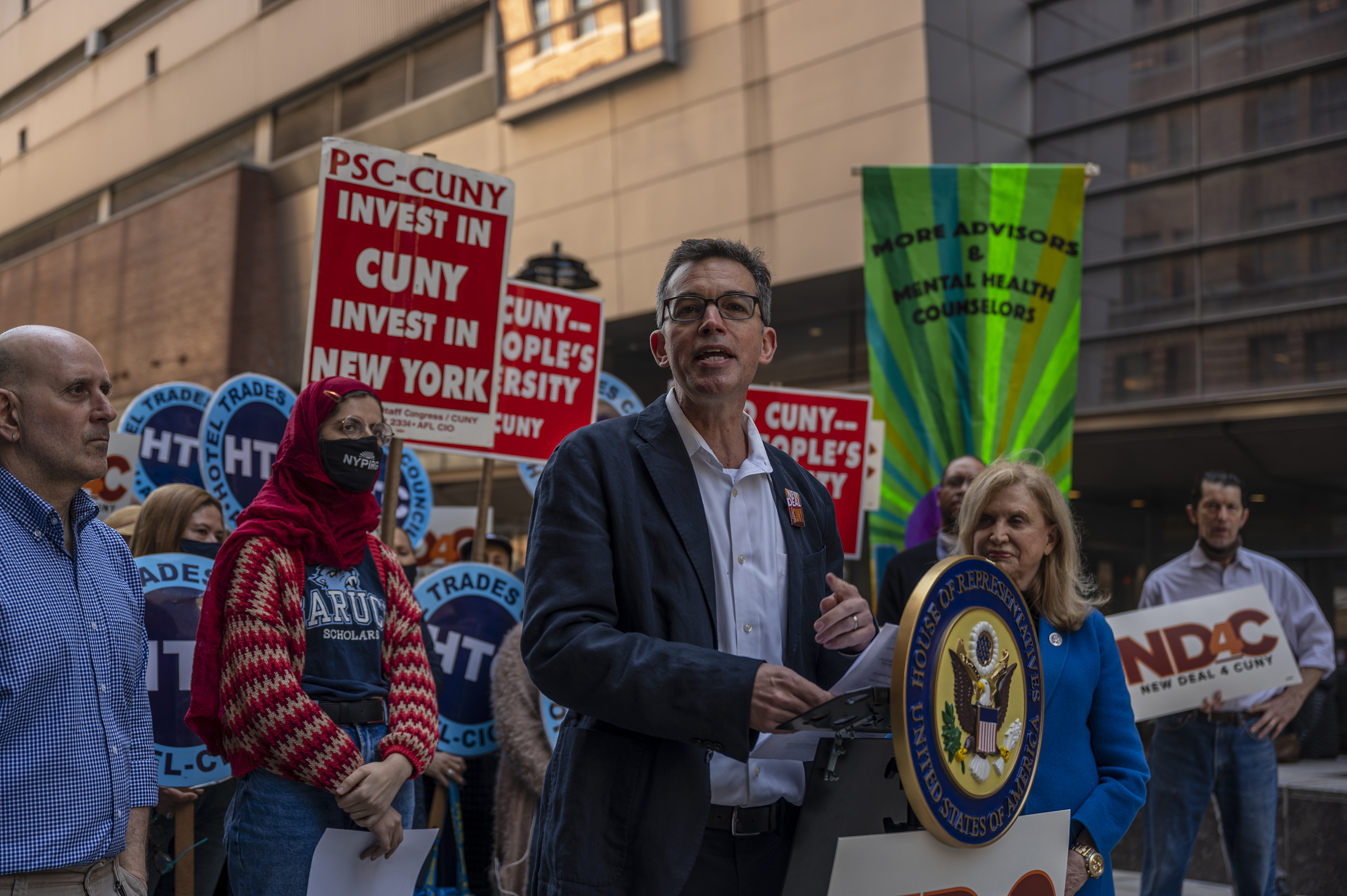 PSC CUNY union leader James Davis joins faculty union members during rally outside Baruch College for free in-state tuition.