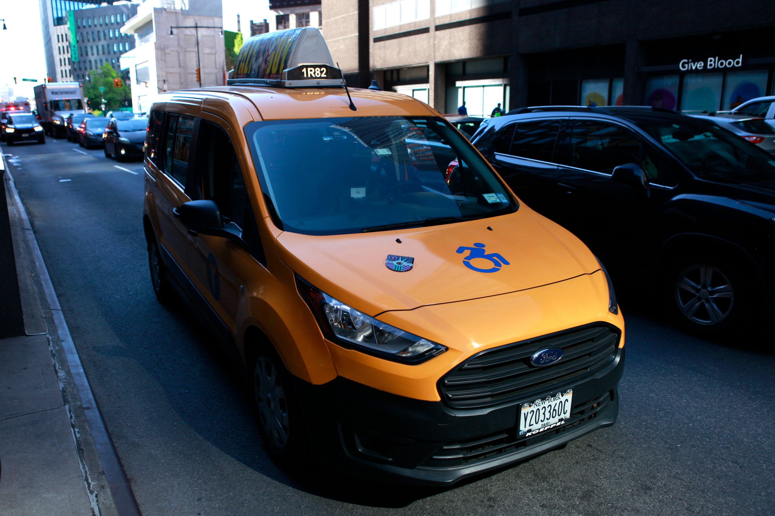 A wheelchair-accessible cab drives along Flatbush Avenue in Brooklyn.