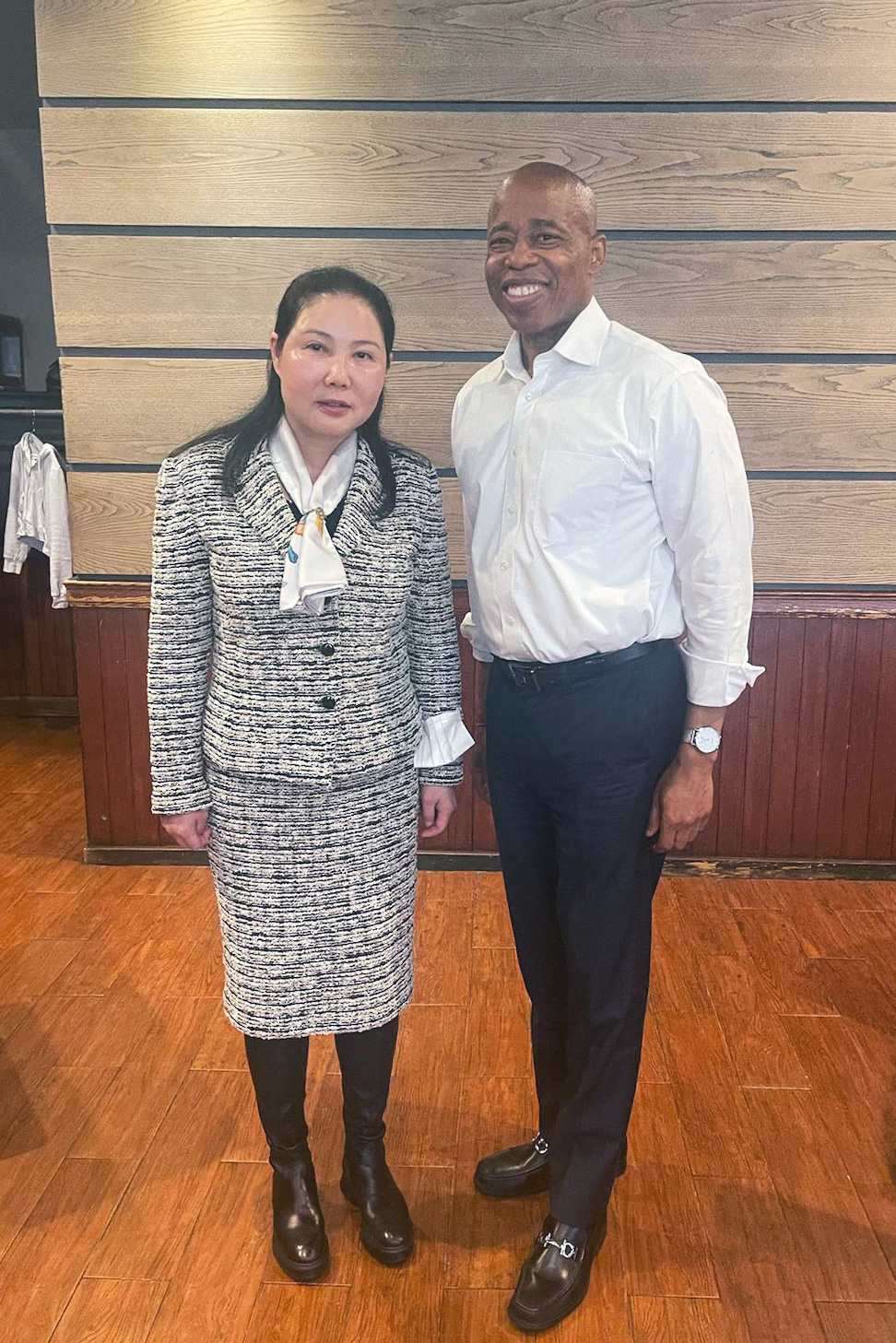 Weihong Hu poses with Eric Adams at the Park Plaza Diner in Downtown Brooklyn.