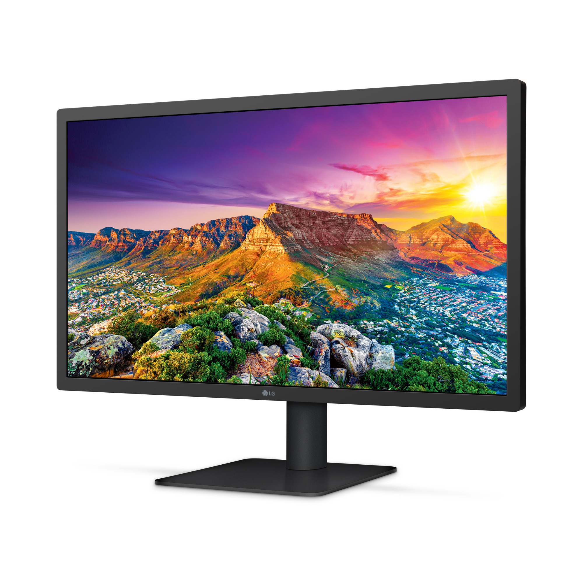 A monitor with a mountain photo displayed